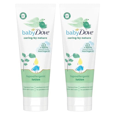 Two tubes of baby Dove hypoallergenic lotion on a white background