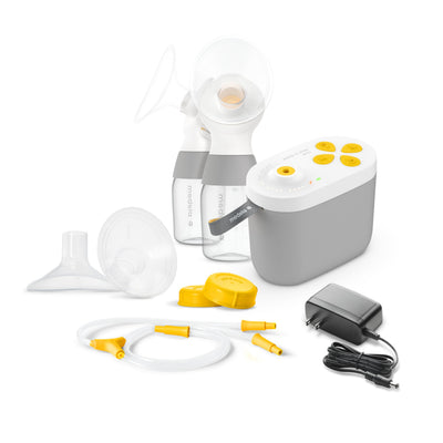 Breast pump set with various components on a white background