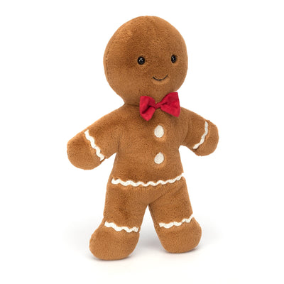 Plush gingerbread man toy with a red bow tie on a white background