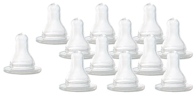 Set of clear baby bottle nipples on a white background