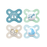 Four baby pacifiers with different designs on a white background