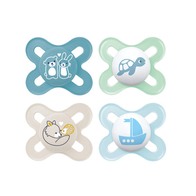 Four baby pacifiers with different designs on a white background