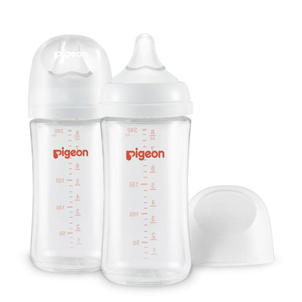 Two clear baby bottles with 'pigeon' branding on a white background