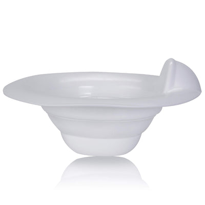 White bowl with a spoon on a white background