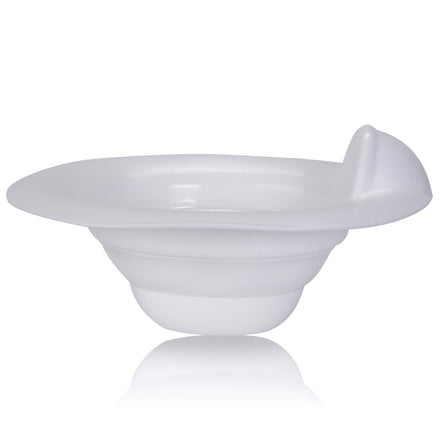White bowl with a spoon on a white background