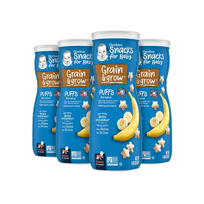 Four containers of Gerber Snacks for Baby Grain & Grow Puffs with banana flavor on a white background.