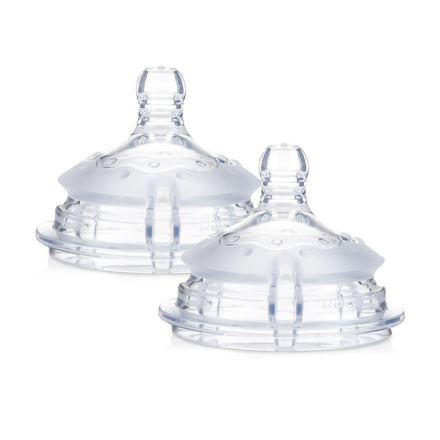 Two clear baby bottle nipples on a white background
