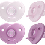 Four purple and white baby pacifiers on a white background