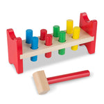Colorful wooden hammering toy with pegs and a hammer on a white background