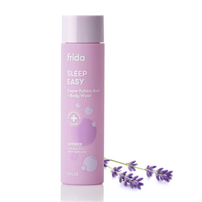 Pink bottle of 'Sleep Easy' vapor bubble bath and body wash with lavender flowers on a white background