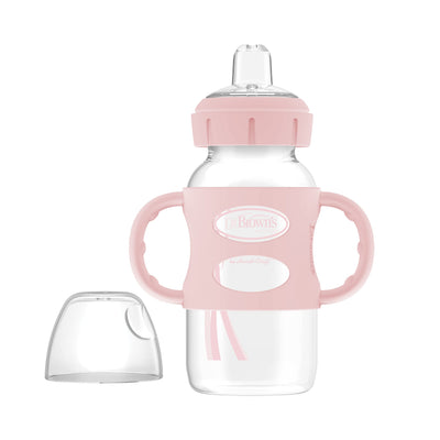 Clear baby bottle with pink handles and lid on a white background