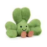 Green plush toy with a smiling face on a white background