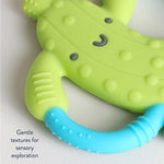 Itzy Ritzy Pickle-Shaped Baby Teether with Handles – Silicone Teether for Babies with Easy-Grab Handles and Textured, Teethable Surfaces – Baby Teething Toy for 3 Months & Up (Pickle)