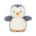 Stuffed penguin toy with a white body, gray wings, and orange feet and beak on a white background