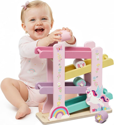 Child playing with a colorful toy ladder on a white background