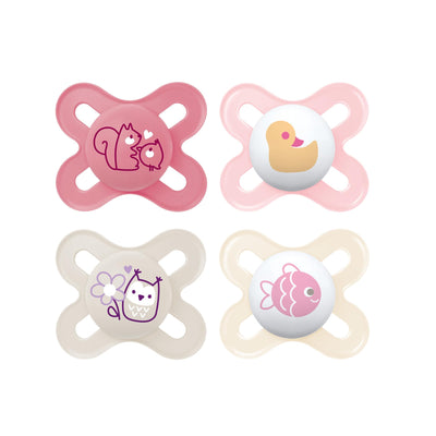 Four pink and beige baby pacifiers with animal designs on a white background