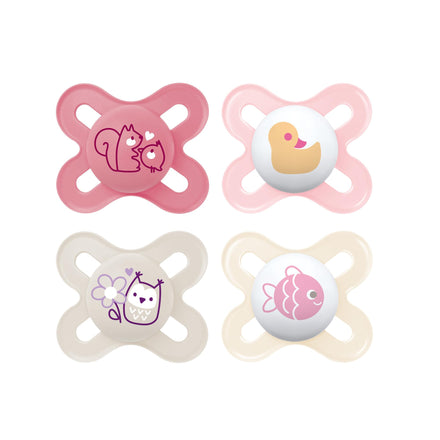 Four pink and beige baby pacifiers with animal designs on a white background
