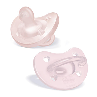 Two pink baby pacifiers on a white background