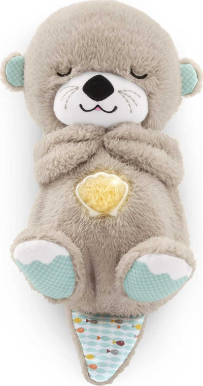 Plush toy resembling a seal with a yellow heart on a white background