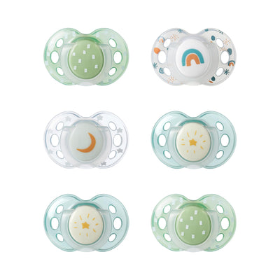 Set of six baby pacifiers with different designs on a white background