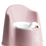 Pink children's potty chair with white seat on a white background