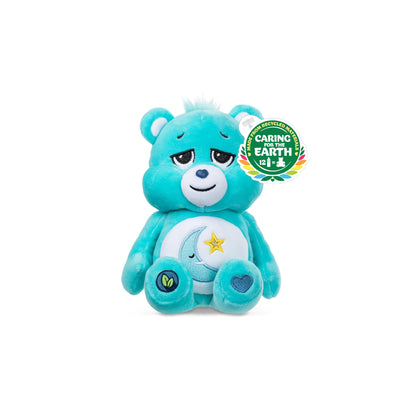 Blue teddy bear with a star and moon design, featuring a 'Caring for the Earth' logo.