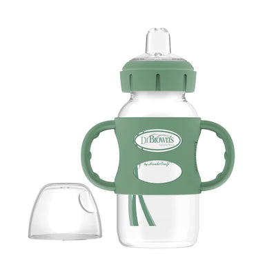 Clear baby bottle with green handles and lid on a white background