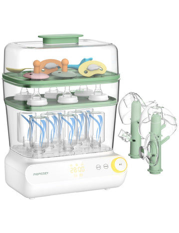 Baby bottle sterilizer with various bottles and accessories on a white background