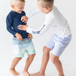 RUGGEDBUTTS Boys UPF50+ Sun Protection Seersucker Swim Trunks - Periwinkle Blue Seersucker, 6-12m
