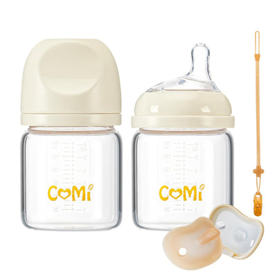Baby bottle set with COMi branding on a white background