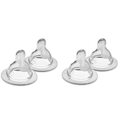 Four clear baby bottle nipples on a white background