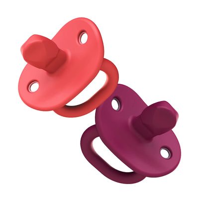 Two colorful pacifiers, one red and one purple, on a white background.