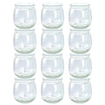 Set of clear glass tumblers stacked on a white background