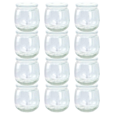 Set of clear glass tumblers stacked on a white background