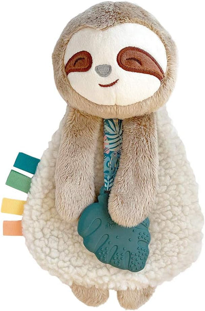 Plush toy sloth with colorful tags and a teething ring on a white background