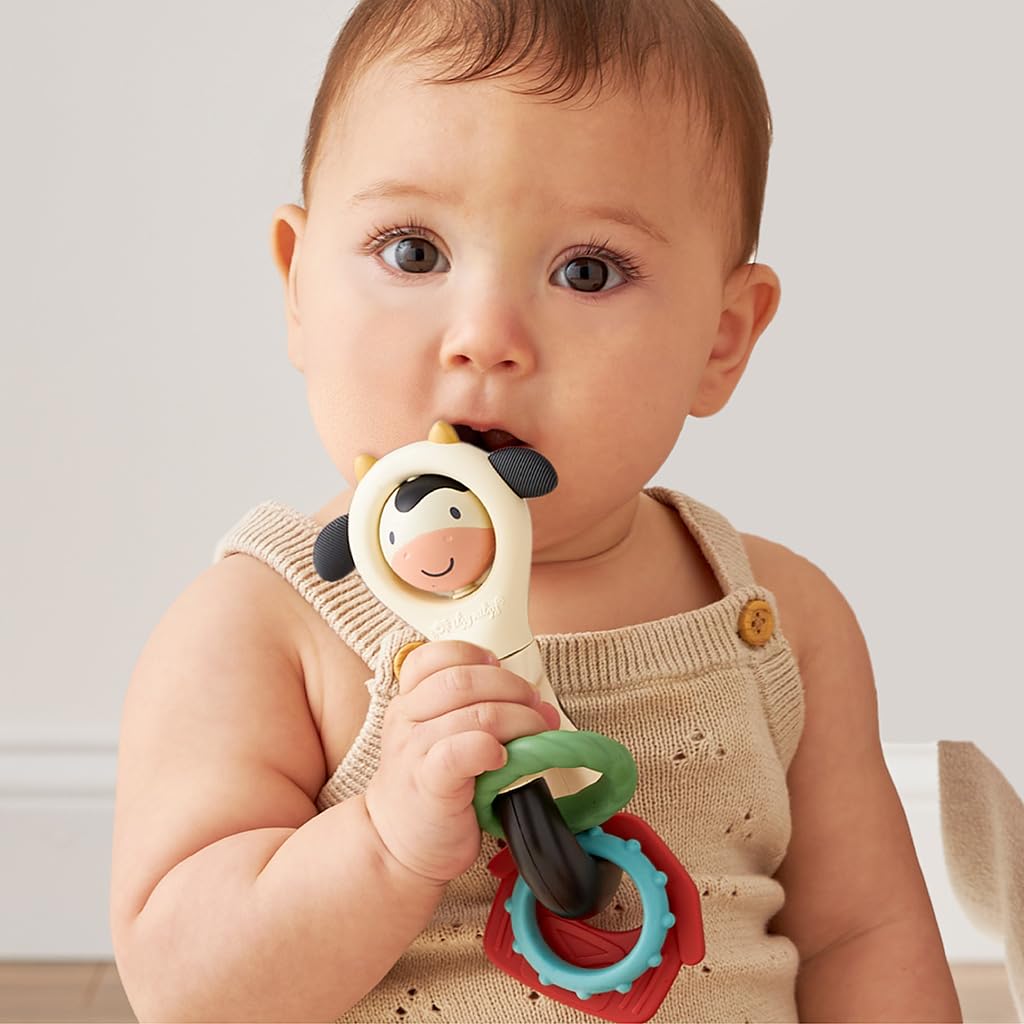 Itzy Ritzy Spinner Rattle Toy – Cow Design Sensory Teething Rattle Includes Spinning Face, Clicks, Rattles & Textured Teethers; Designed for Ages 3 Months and Up (Cow)