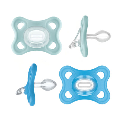 Two baby pacifiers, one light blue and one blue, on a white background.