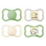 Four baby pacifiers with different designs on a white background