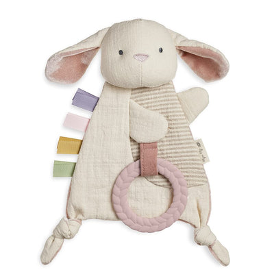 Plush bunny toy with a ring on a white background