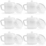 Set of white ceramic teapots with lids on a white background