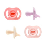 Set of four colorful baby pacifiers on a white background
