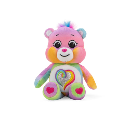 Colorful plush toy with a heart design on a white background