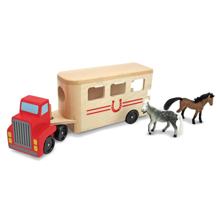 Wooden toy truck with horse trailer and two horses on a white background