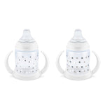 Two baby bottles with star and triangle patterns on a white background