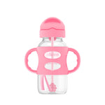 Pink and clear sippy cup with handle on a white background