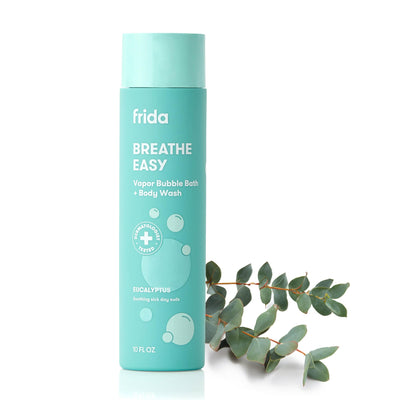 Teal bottle of 'frida Breathe Easy' vapor bubble bath and body wash with eucalyptus leaves on a white background