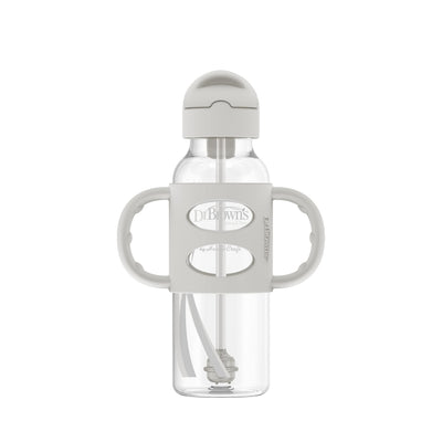 Clear baby bottle with handles and white cap on a white background