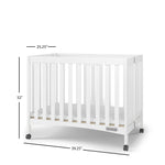 Child Craft London Mini Compact Folding Portable Crib with 2” Crib Mattress and 2 Easy Roll Locking Wheels, Durable Pine Wood Construction (Matte White)
