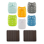 Set of colorful baby cloth diapers with snap closures on a white background