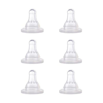 Set of six clear baby bottle nipples on a white background